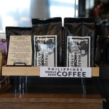 Philippine whole bean coffee bags displayed at BookBurn Cafe and Social in Orlando