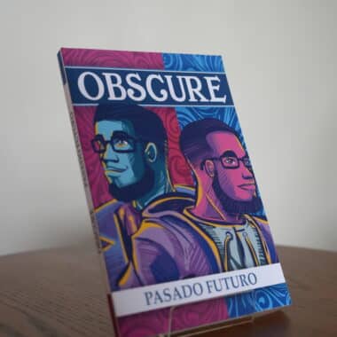 Obsgure Pasado Futuro book displayed on a table at BookBurn Cafe and Social