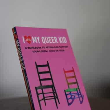 I Love My Queer Kid workbook displayed at BookBurn Cafe and Social in Orlando