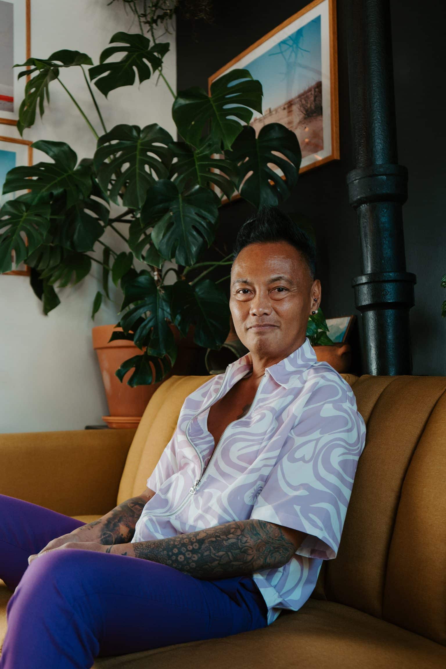 Jonny Cruz, owner of BookBurn Cafe and Social, seated inside the café in Orlando’s Milk District.