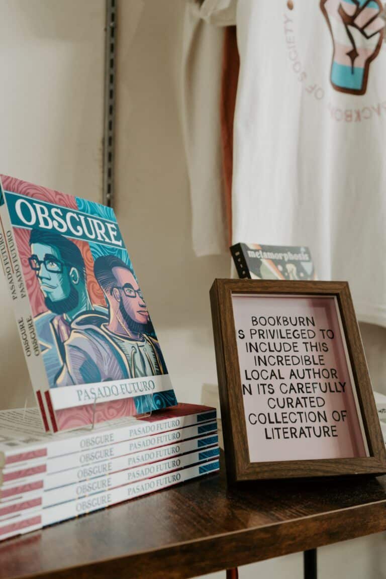 Display of books by a local author inside BookBurn Cafe and Social in Orlando’s Milk District.