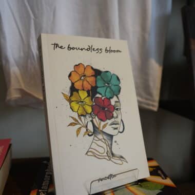 The Boundless Bloom book displayed on stand at BookBurn Cafe and Social in Orlando
