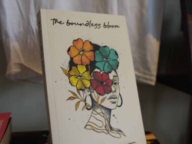 The Boundless Bloom book displayed on stand at BookBurn Cafe and Social in Orlando