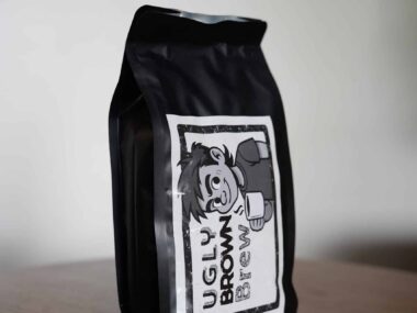 Ugly Brown Brew Philippine whole bean coffee bag on table at BookBurn Cafe in Orlando