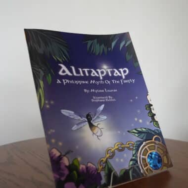 Alitaptap: A Philippine Myth of the Firefly children’s book displayed upright on a table at BookBurn Cafe and Social