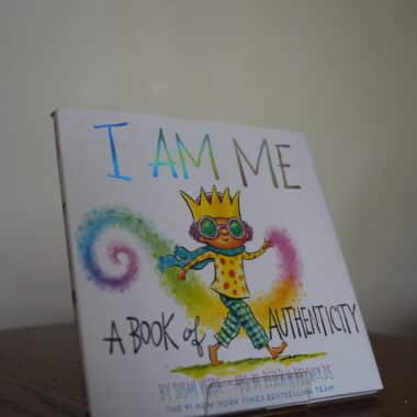 I Am Me: A Book of Authenticity children’s book displayed on a table at BookBurn Cafe and Social